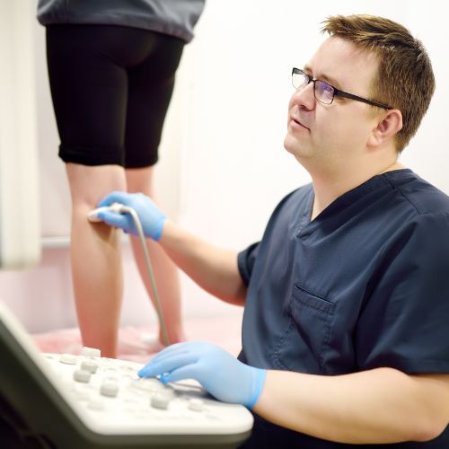 doctor checking a vascular issue using ultra sound