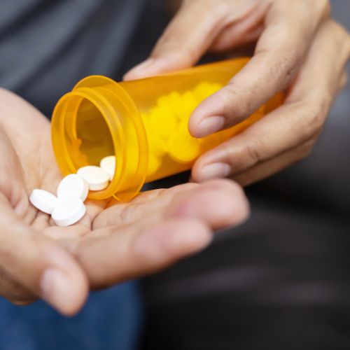 person taking medication for high blood pressure