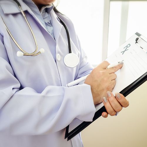 physician assistant examining paperwork