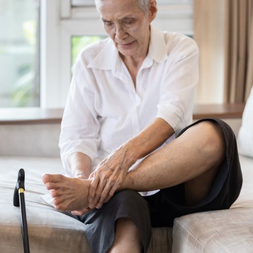 Older woman experiencing PAD symptoms in legs