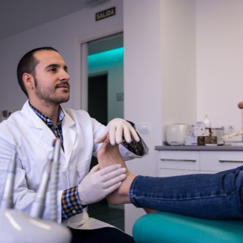 doctor discussing plantar fascia embolization with patient