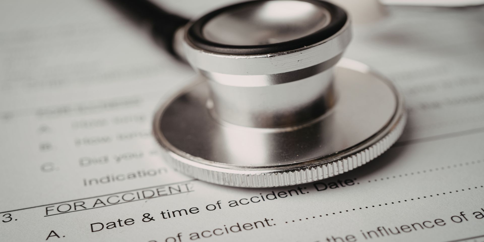Stethoscope laying on top of medical paperwork