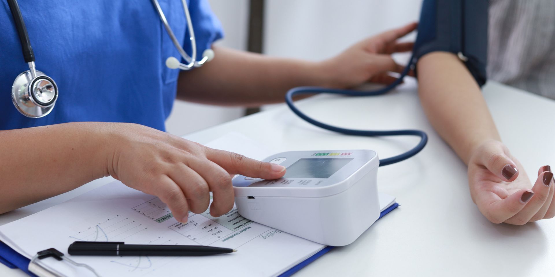 Doctor checking a patient’s blood pressure