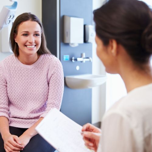 patient and doctor discussing vasculaze vs. sclerotherapy