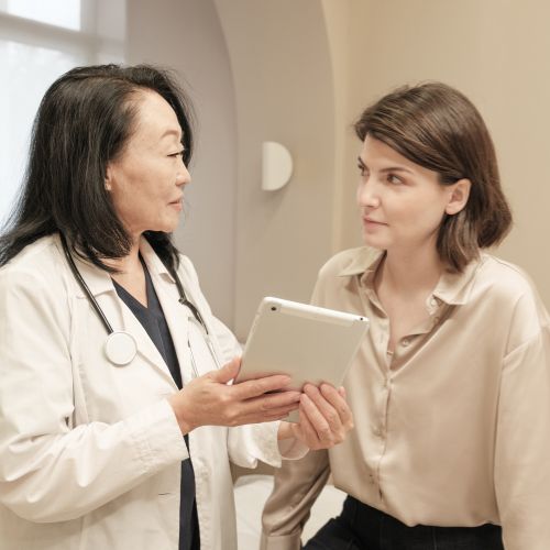 Doctor explaining treatments for chronic limb pain to a patient
