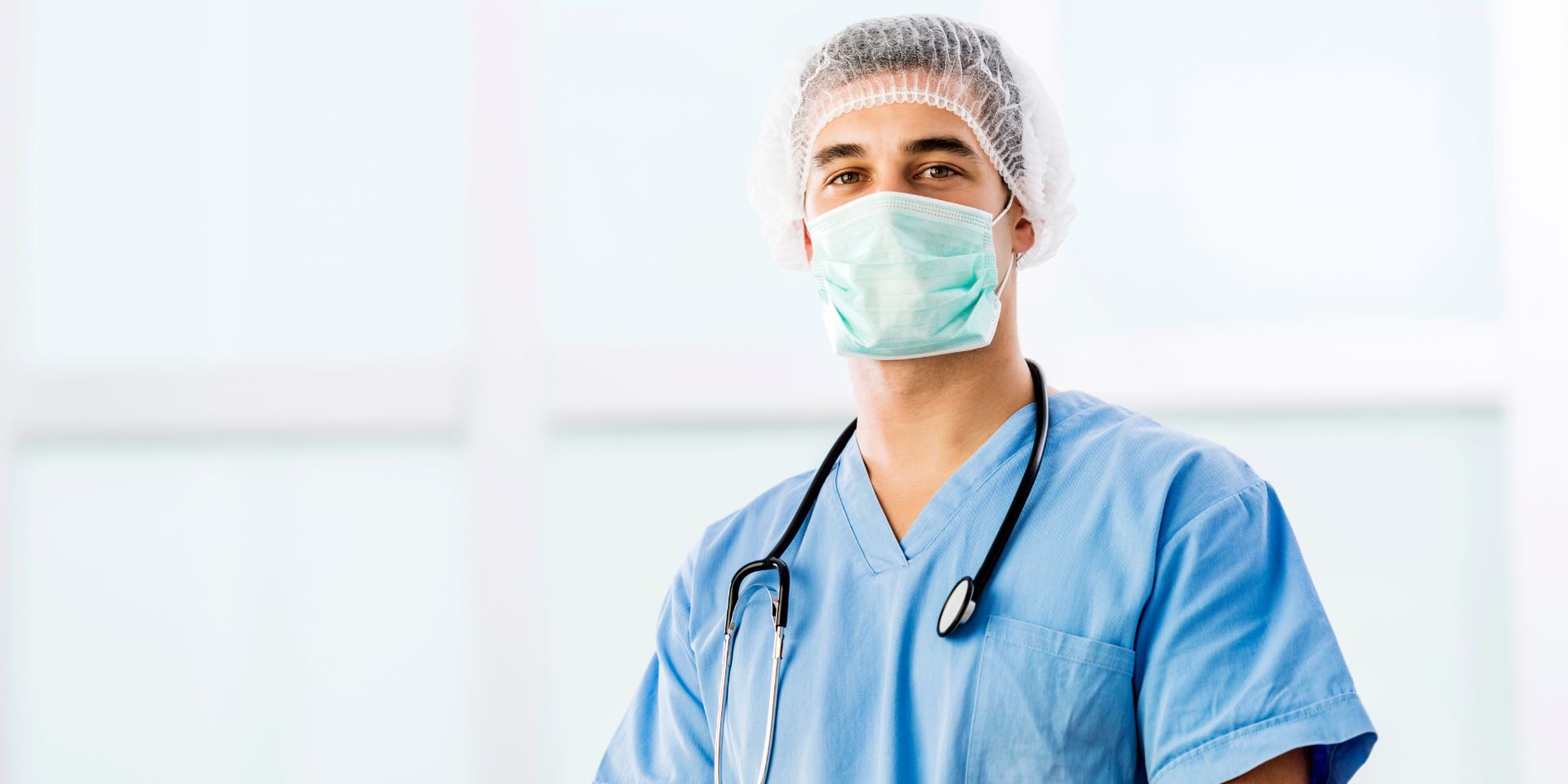 vascular surgeon in scrubs and face mask