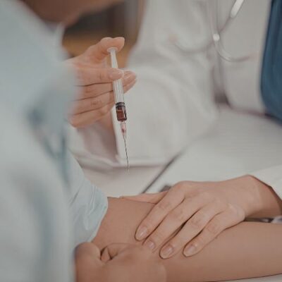 vein doctor taking a blood sample form a patient
