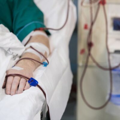 person in hospital bed for kidney dialysis access