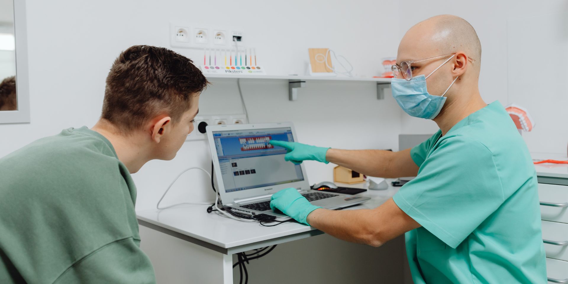 doctor explain results of a free vein screening to his patient