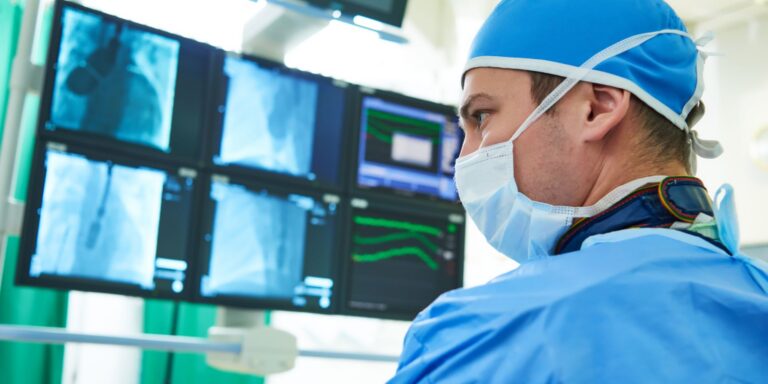 vascular surgeon examining a patient’s x-rays