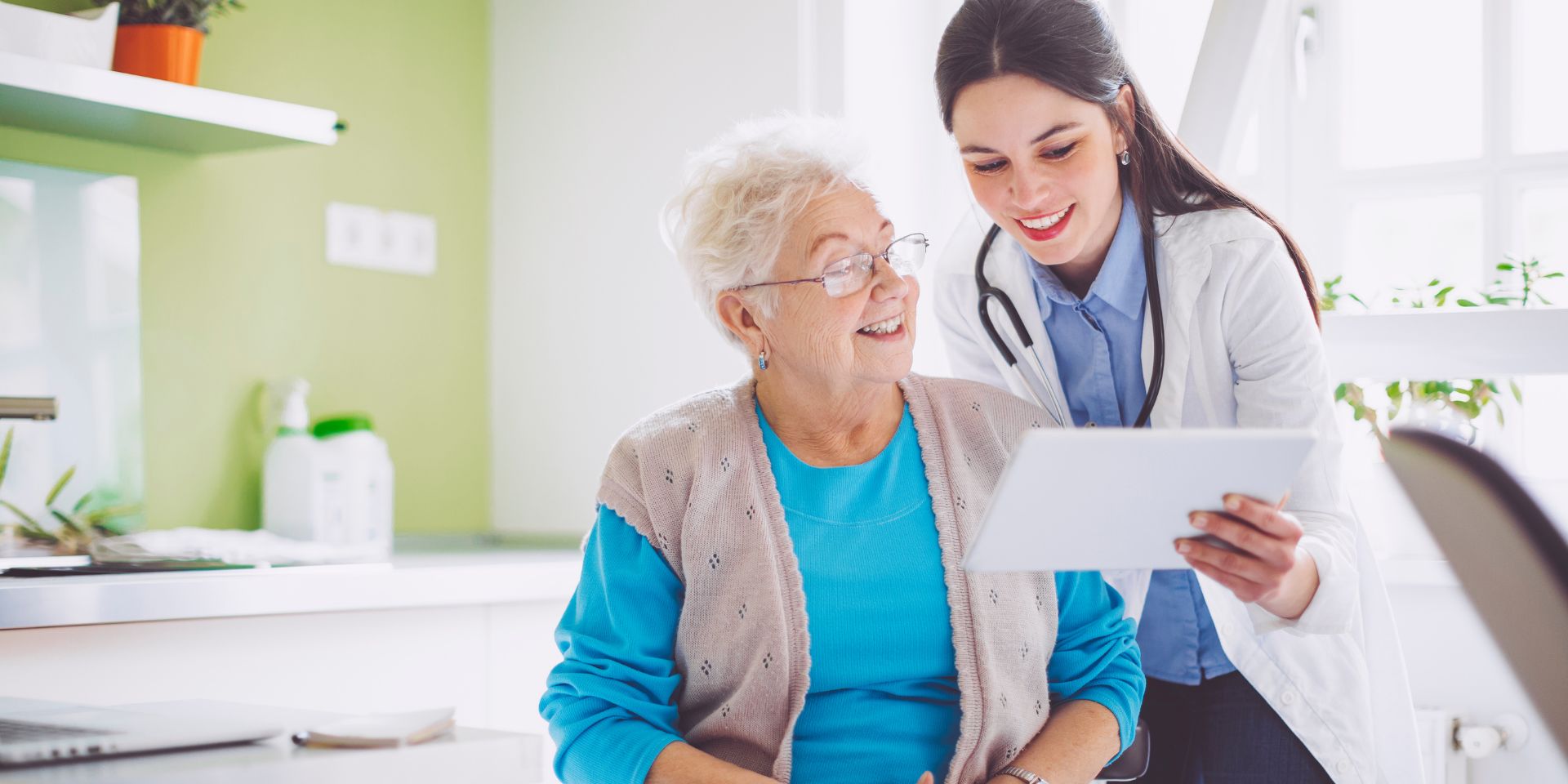 doctor showing a patient how to treat blood clots on a tablet