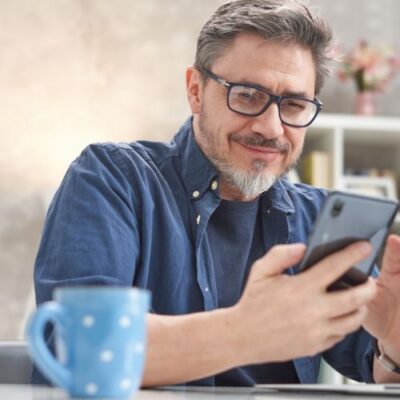 Man searching vascular surgeon near me on his phone