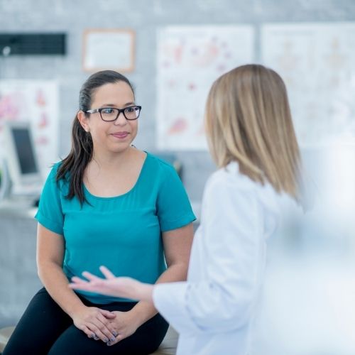 doctor explaining what is sclerotherpay to a patient